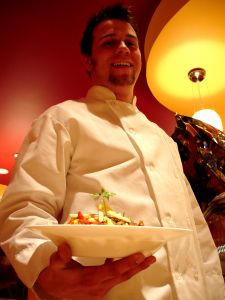 restaurant chef with pasta dish