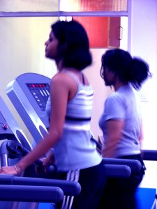 women on treadmill in gym
